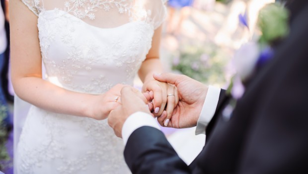 Bride and groom's hands with wedding rings